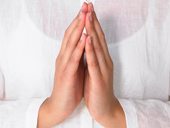 Woman's praying hands