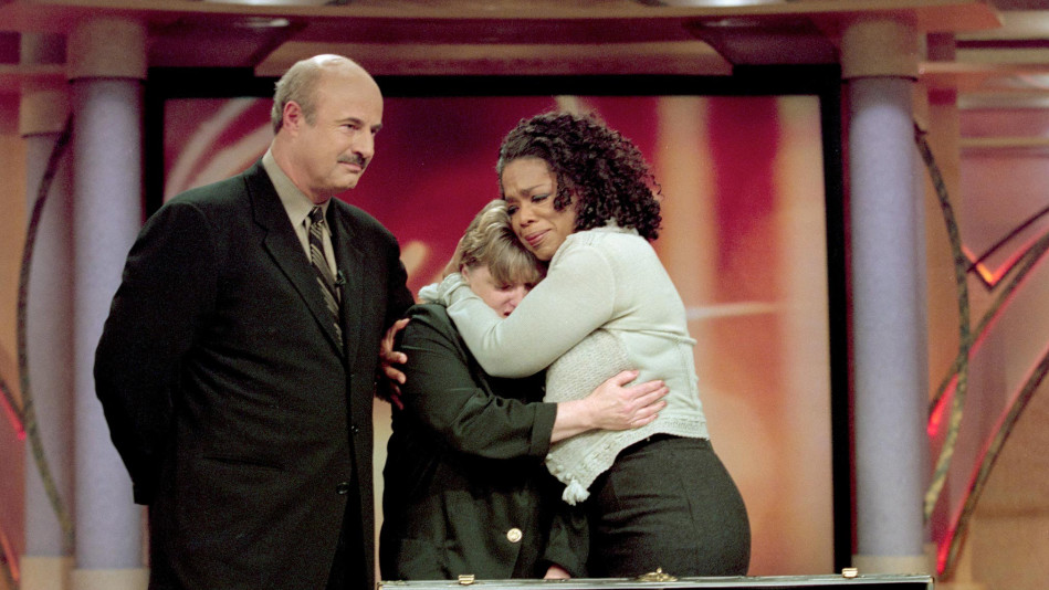 Oprah hugging guest with Dr. Phil on The Oprah Winfrey Show
