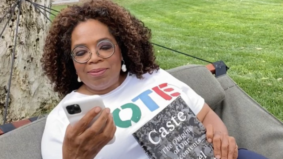 Oprah at home wearing 'Vote' t-shirt