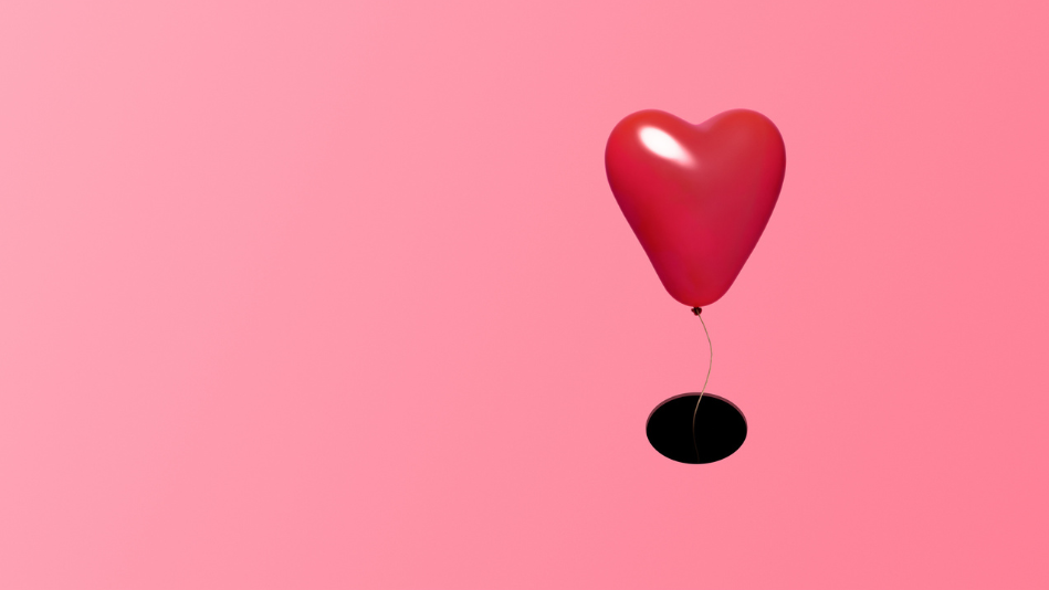 heart-shaped balloon drifting into a dark hole