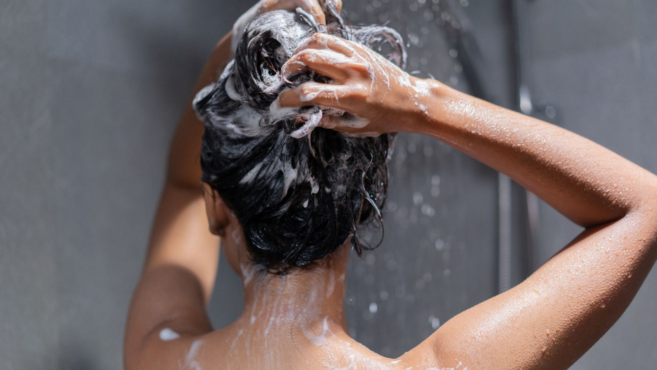 woman shampooing hair