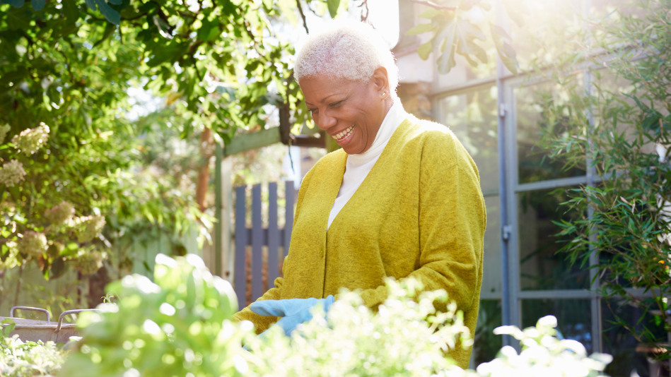Senior Black woman gardening