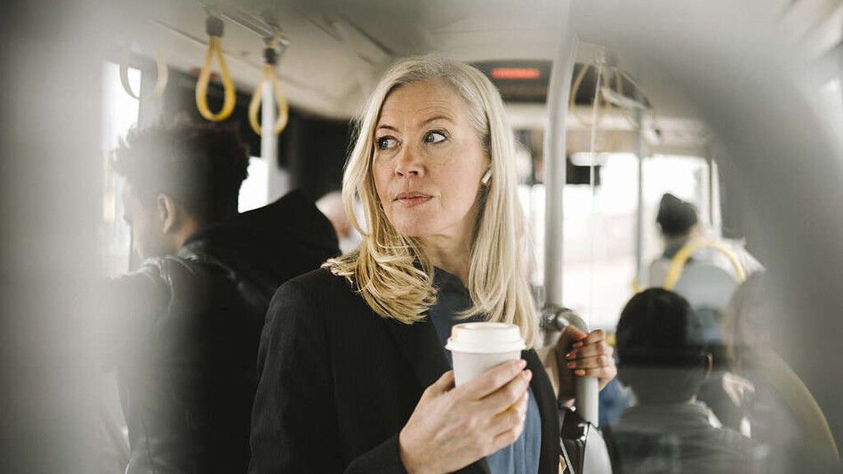 Woman deep in thought on her morning commute