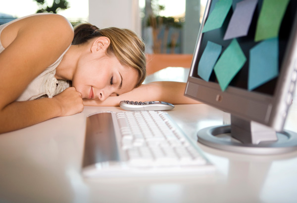 Woman Sleeping at Desk