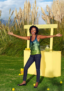 Woman happy at a lemonade stand