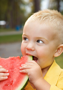 Child eating a watermelon