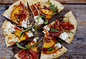 Grilled Cornmeal Flatbreads with Peaches, Serrano Ham, and Spicy Greens