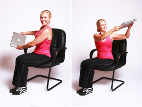 Andrea Metcalf demonstrates the spine rotation exercise with a laptop.