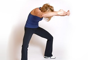 Andrea Metcalf demonstrates the lower back rounded stretch.