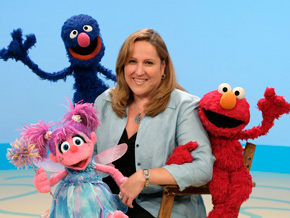 Carol-Lynn Parente with Sesame Street characters