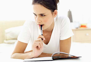 Woman writing in journal