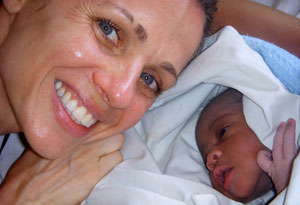 Seane Corn with Miriam's baby in Uganda