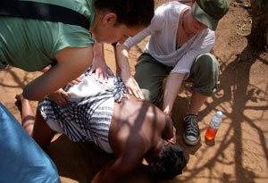 Seane Corn aiding a woman in labor in Uganda