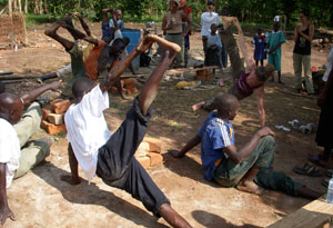 Seane Corn practicing yoga in Uganda.
