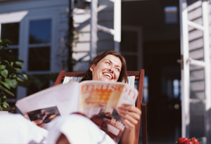 Woman in chair with magazine