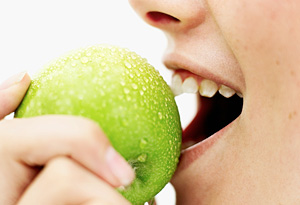 Teen girl eating apple
