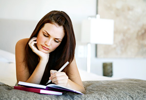 Woman writing in journal
