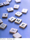 Letter game tiles spelling 'TIME'