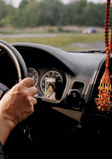 Sally Goodrich's dashboard with Afghan prayer beads and photo of her son Peter